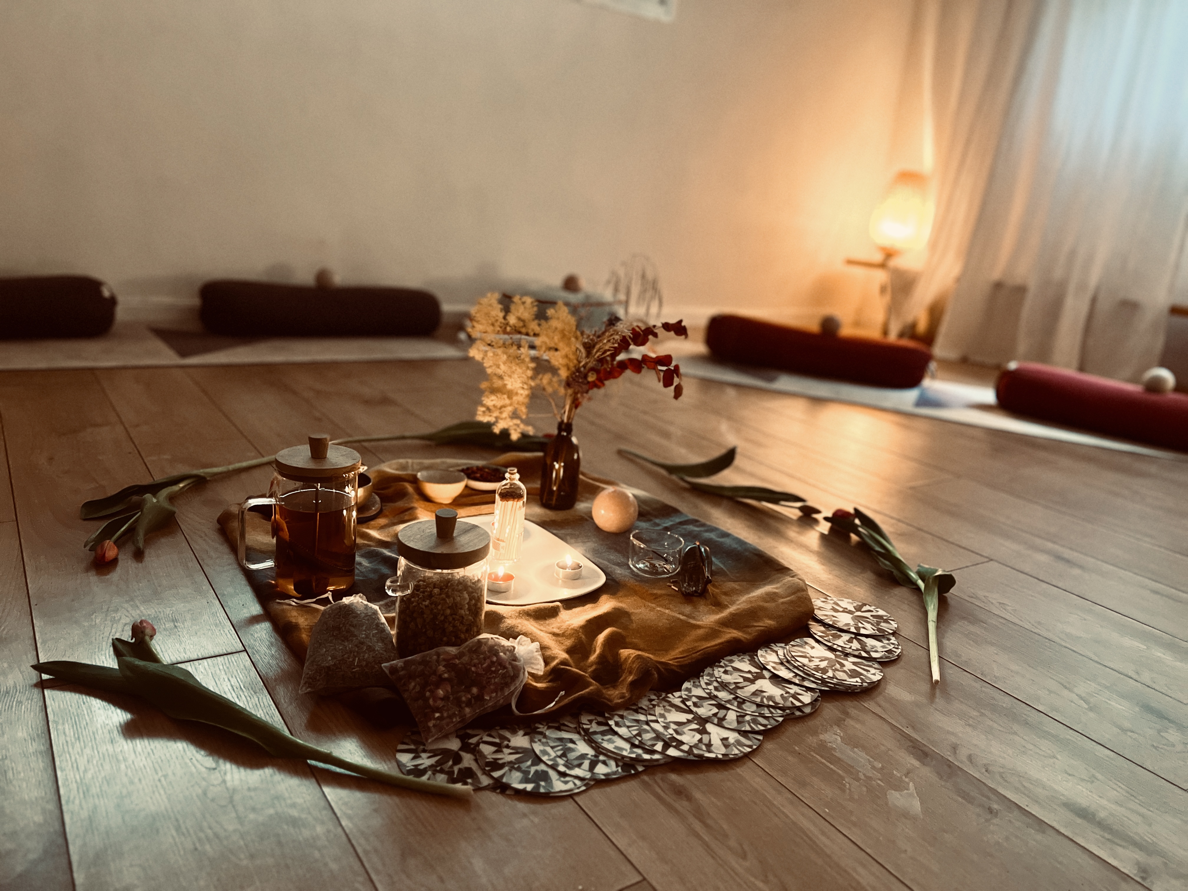 A candlelit gathering space prepared for a circle